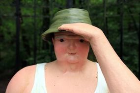 figure in a hat