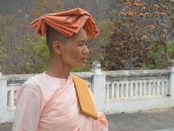 Buddhist woman in a pink clothing