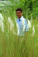 young man on a green meadow