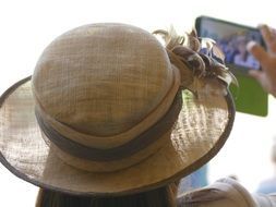 girl in a hat makes selfie