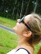 smiling caucasian girl in sunglasses outdoors