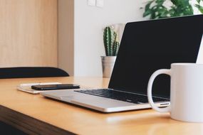 white mug on the office desk