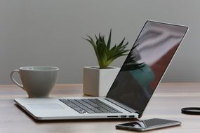 iPhone and laptop on the table