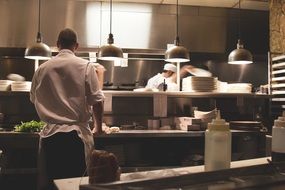 the cooks are busy in the kitchen