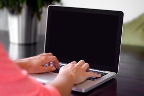 Female working on a macbook