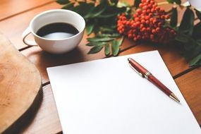 blank paper, pen and coffee