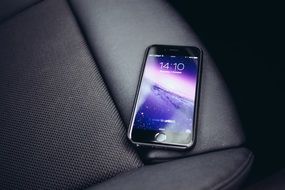 mobile phone lies on a chair