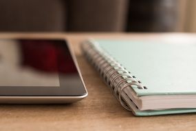 notebook and ipad on the table