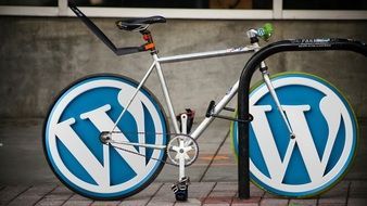 Bicycle with wordpress logo on the wheels