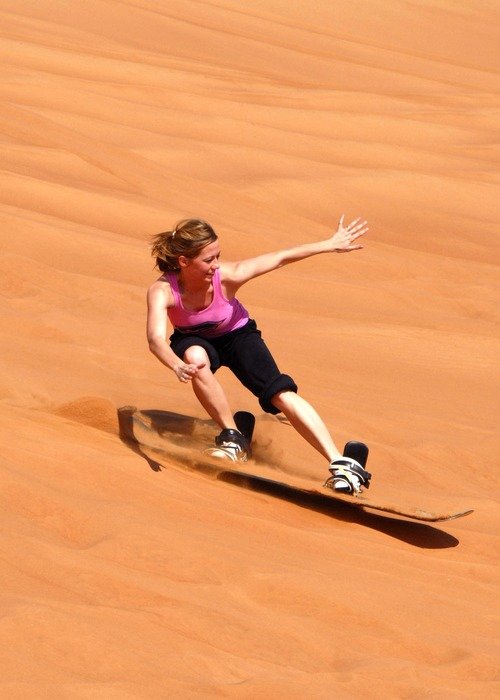 Photo of Girl sandboarding