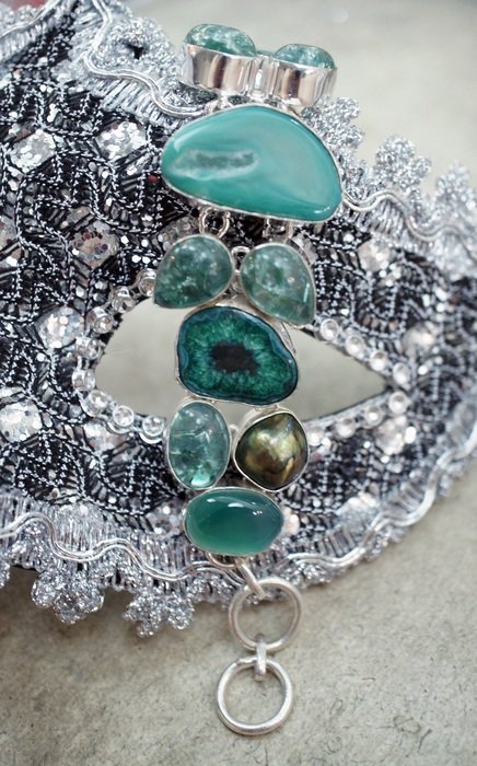 blue stones bracelet and carnival mask