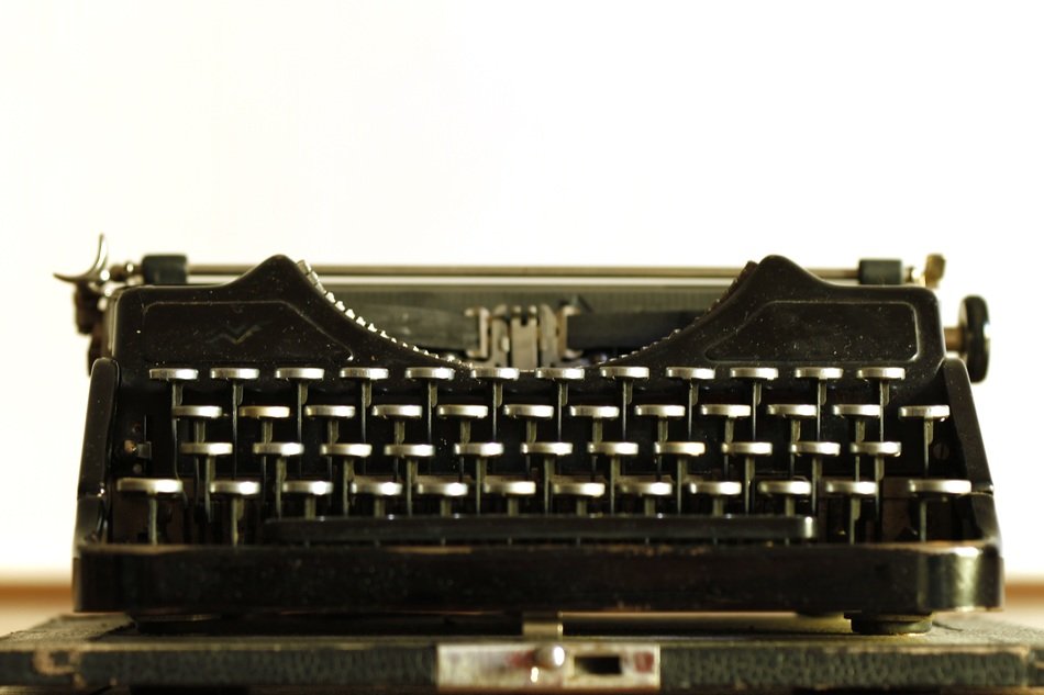 retro typewriter on white wall background