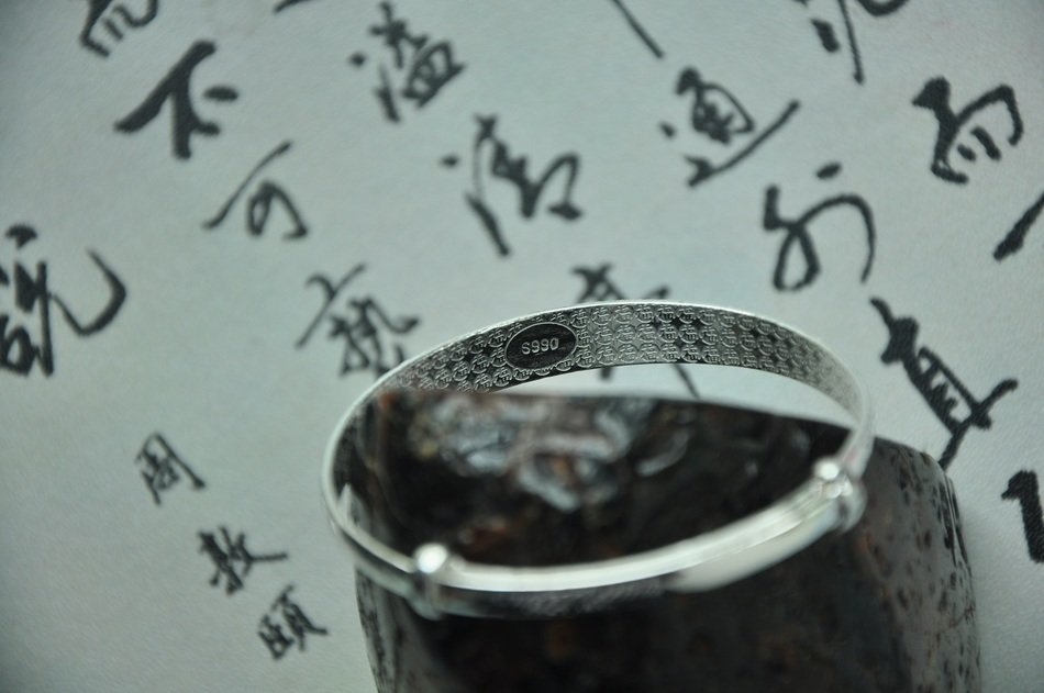 silver bracelet on background hieroglyph