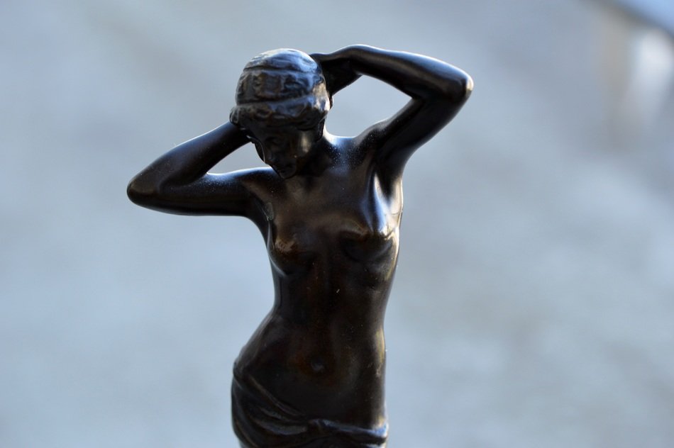 a small sculpture of a woman