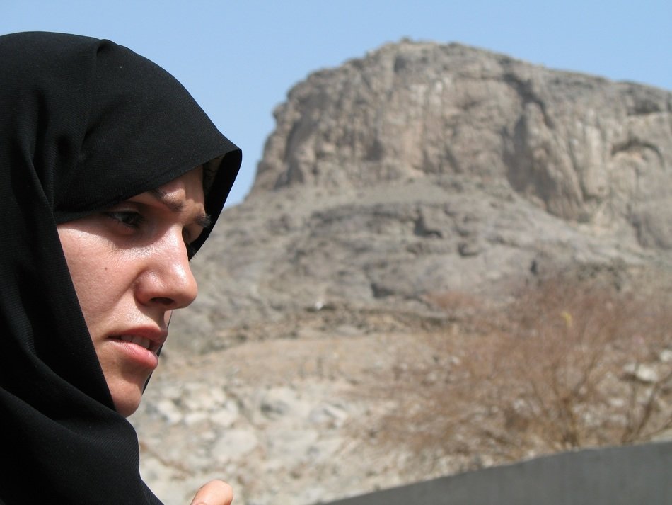 muslim woman on the rocks background