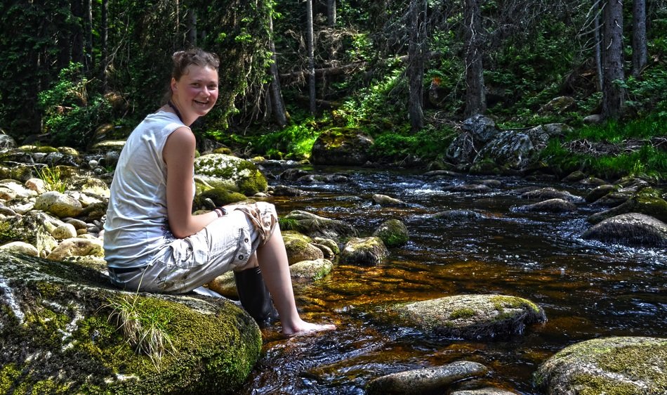 girl at the forest river