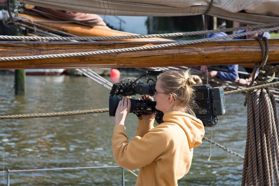 reporter woman journalist shooting waterfalls