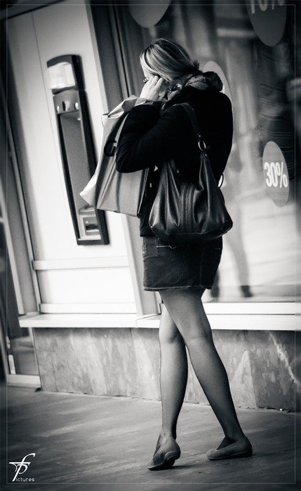 black and white photo of the woman talking on the phone