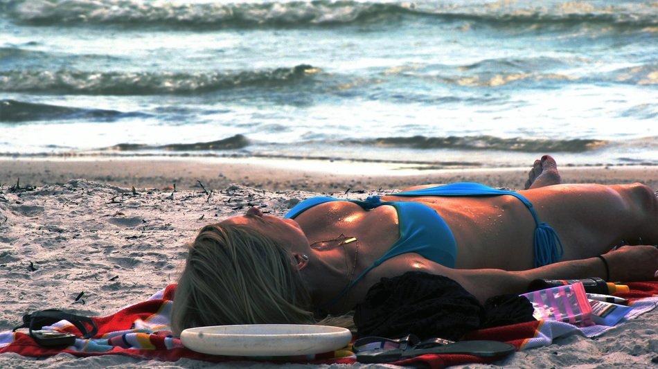 girl sunbathing on beach