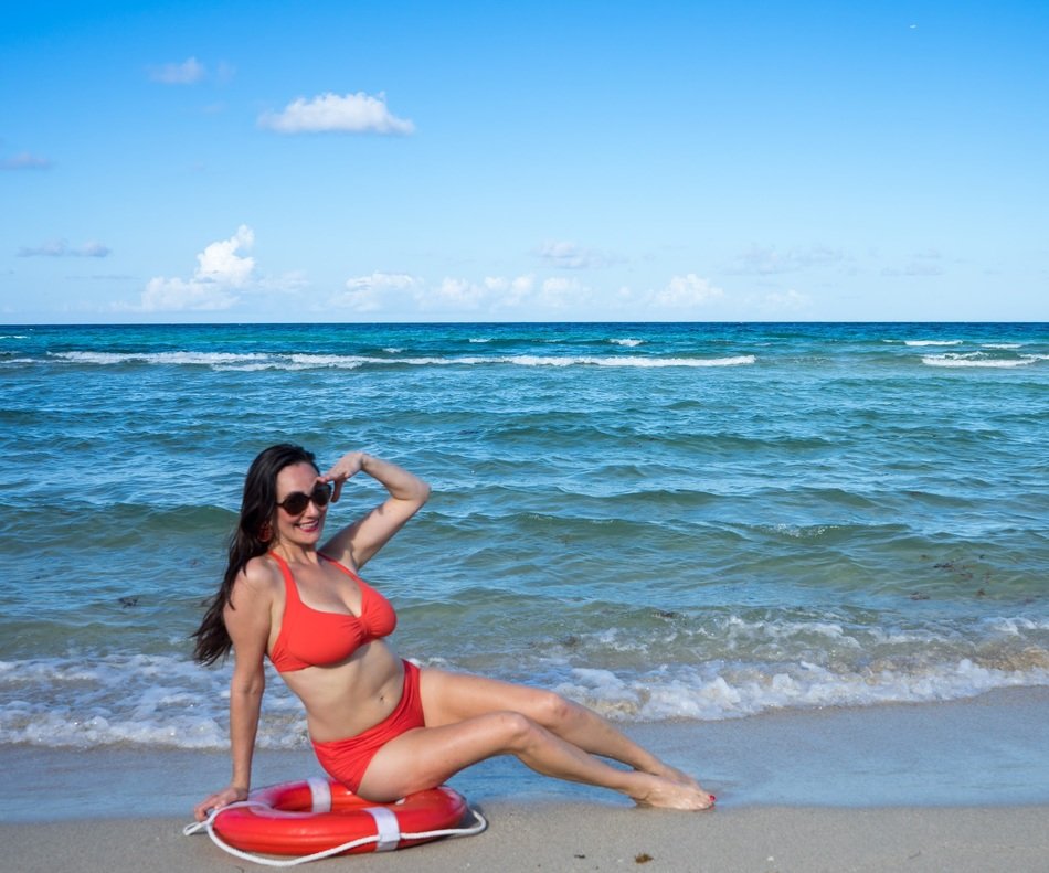 woman in red swimsuit and sunglasses
