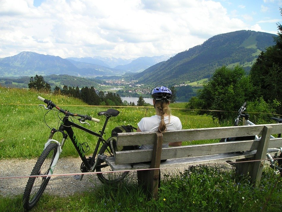 bike near the girl on the bench