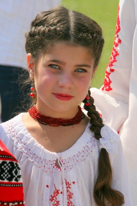 little girl in traditional dress like a peasant woman