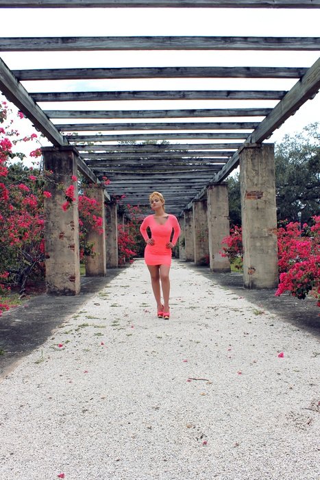 girl in a pink dress in the alley