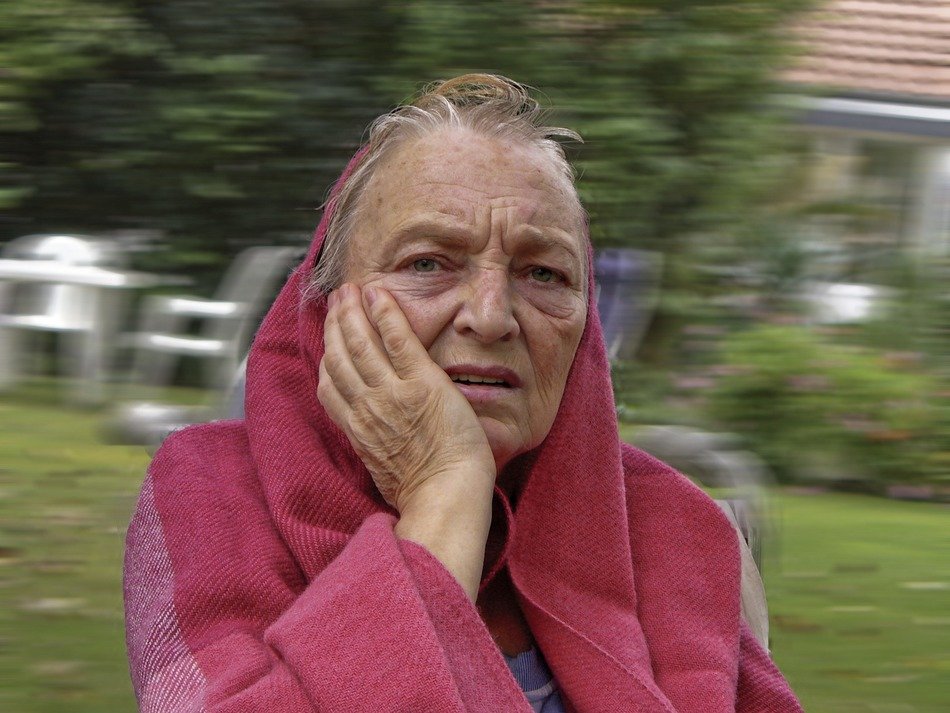 Portrait of diseased old woman