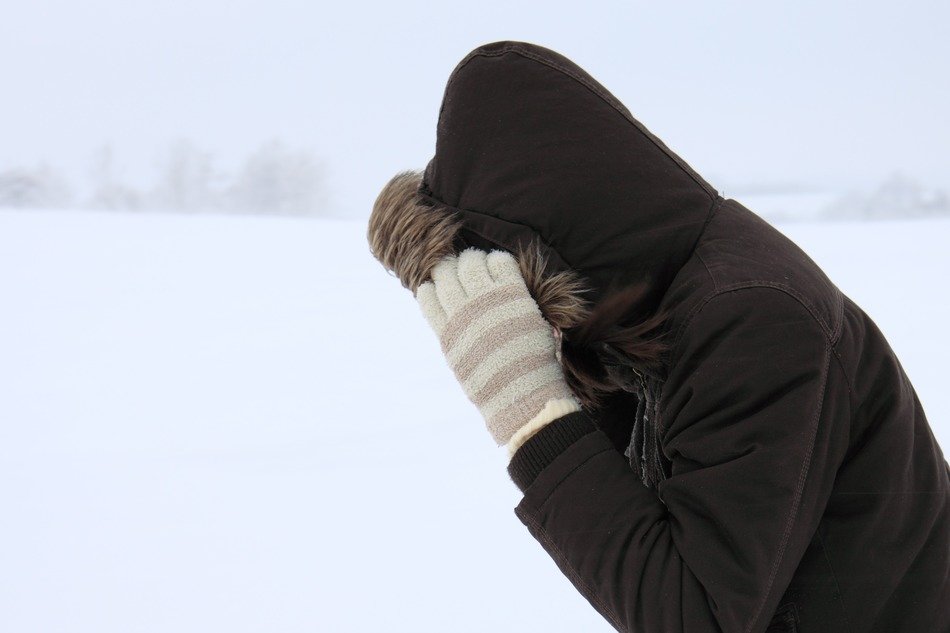 man in jacket during a blizzard