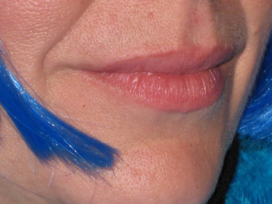 lips and artificial a strand of blue hair