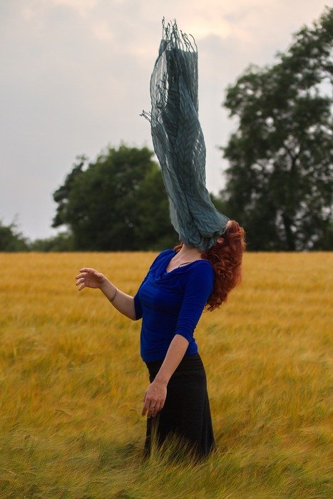 woman with scarf on the field