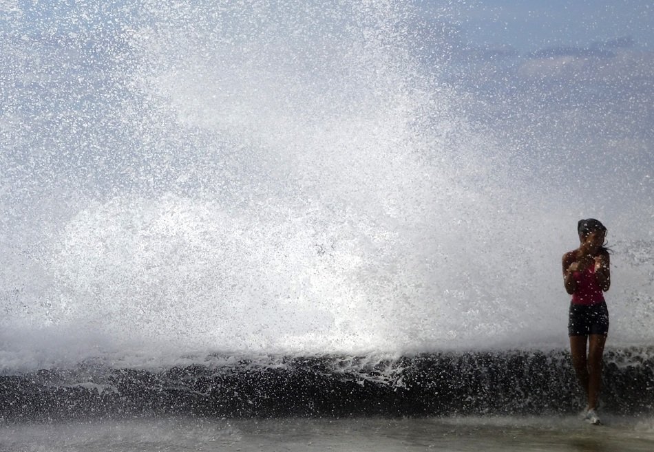 A girl near the high wave