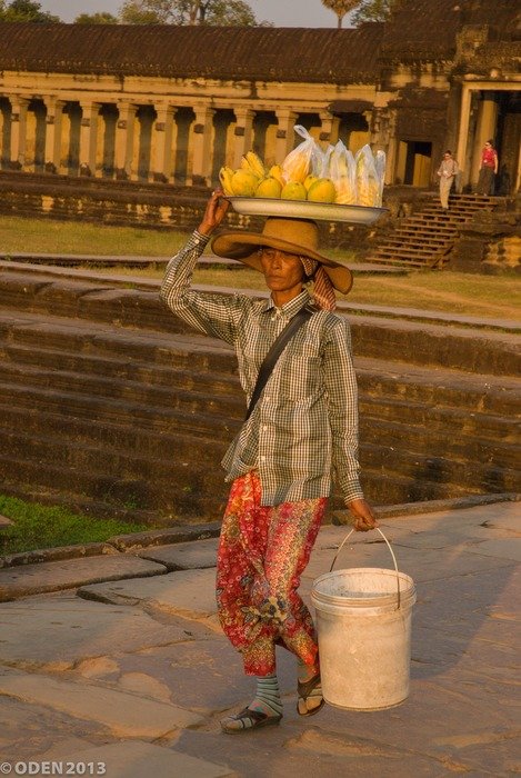 vendor with fruits on head, cambodia, Siem Reap