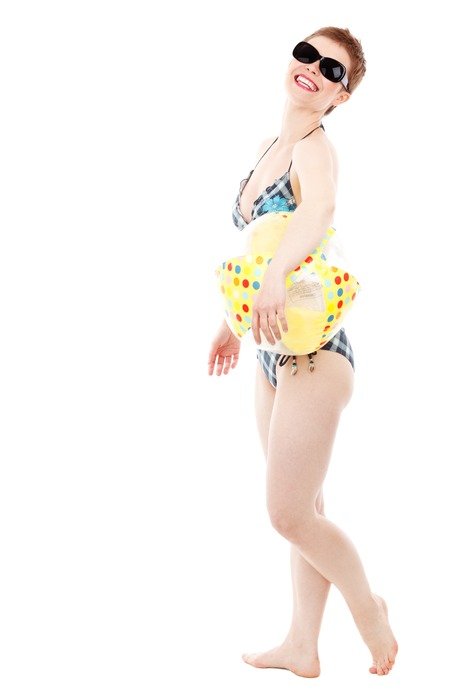 photo of the girl in a bathing suit and a ball