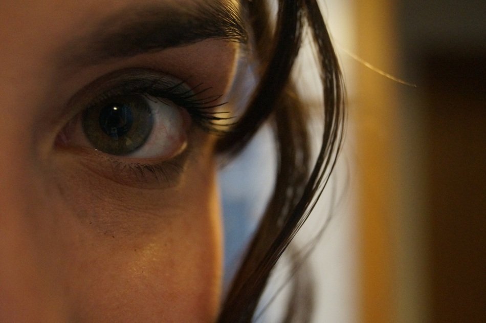 Closeup photo of woman's green eye