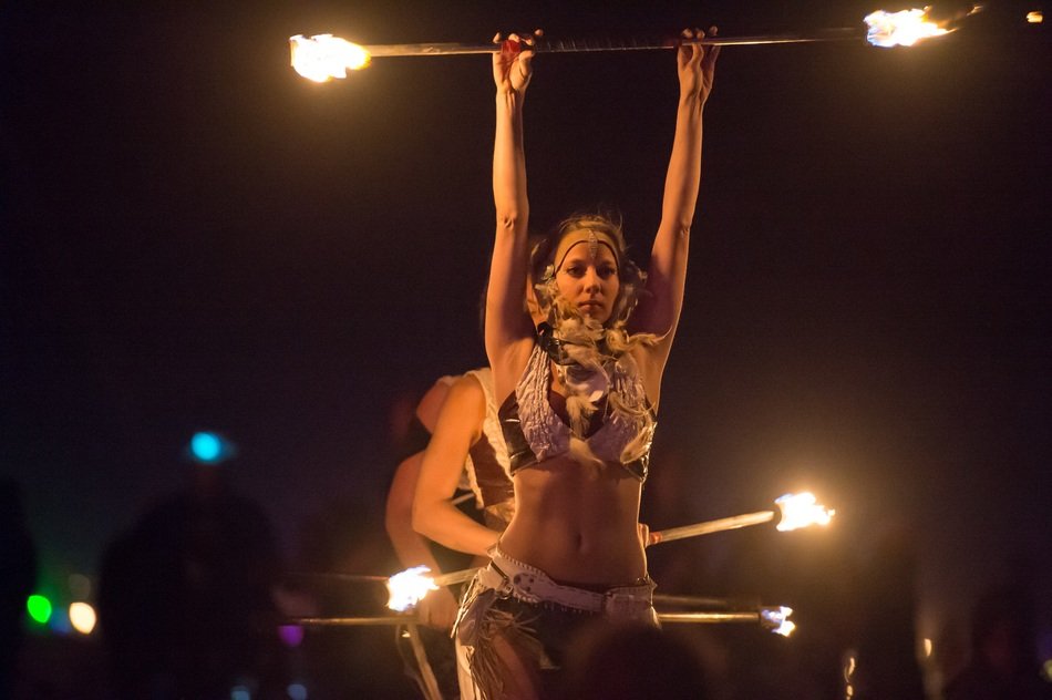 Photo of fire dancers at night