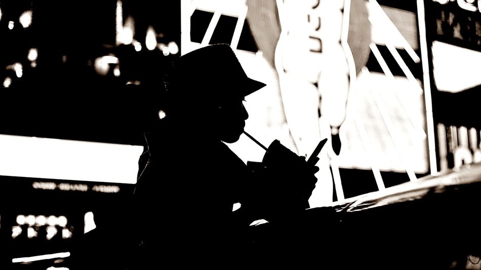silhouette of a woman with a drink