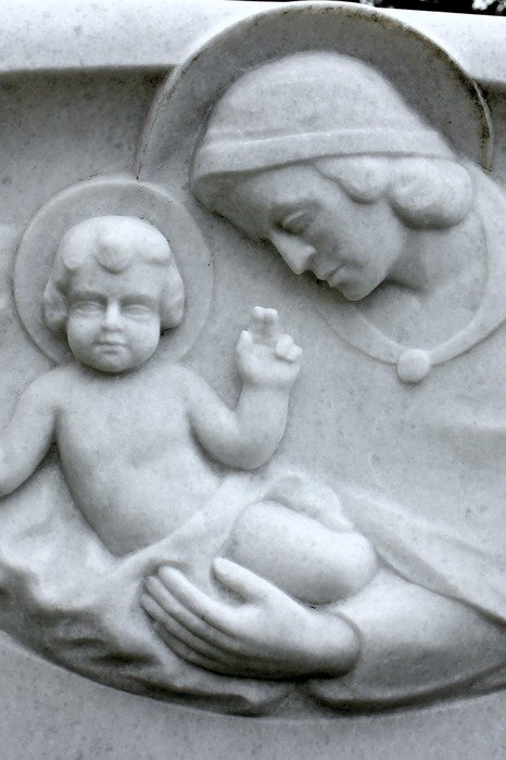 stone sculpture of woman and baby