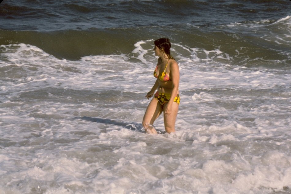 wading woman in the ocean