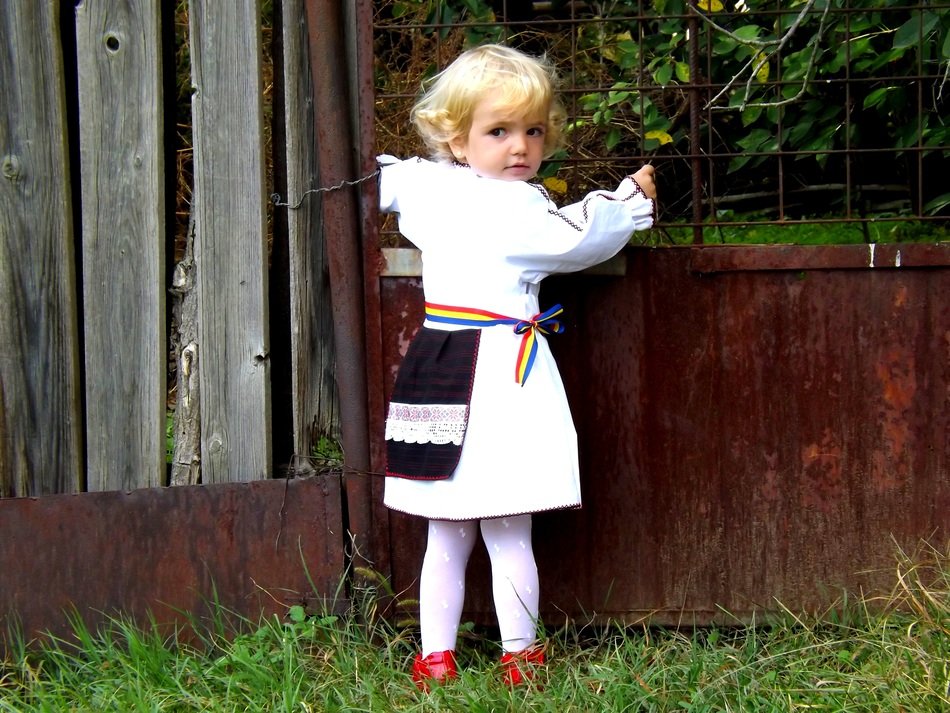 Cute child girl in traditional clothes