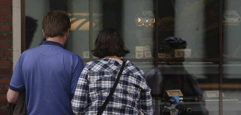 man and woman before storefront