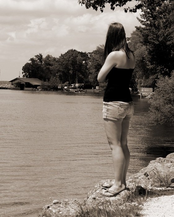 thinking woman on the shore