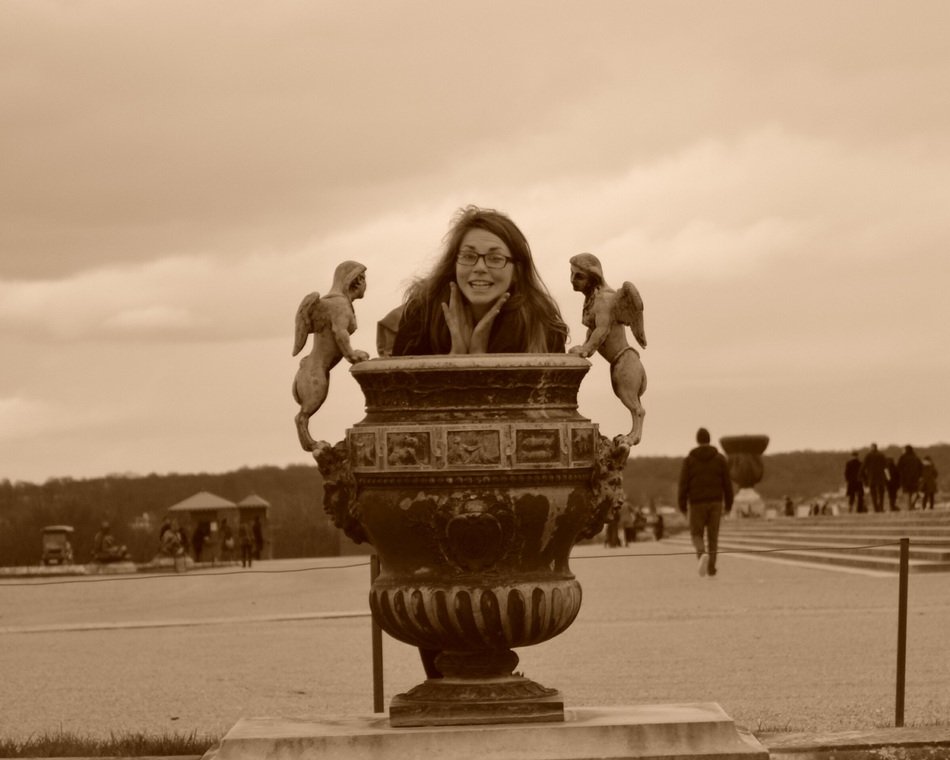 woman near a vase in Versailles