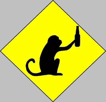 monkey with a bottle on a yellow sign