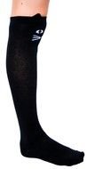 female leg in long black sock with cat head ornament