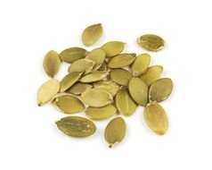 peeled pumpkin seeds on a white background