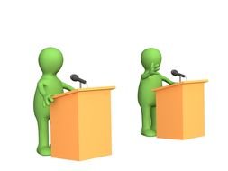 painted two green people behind a podium