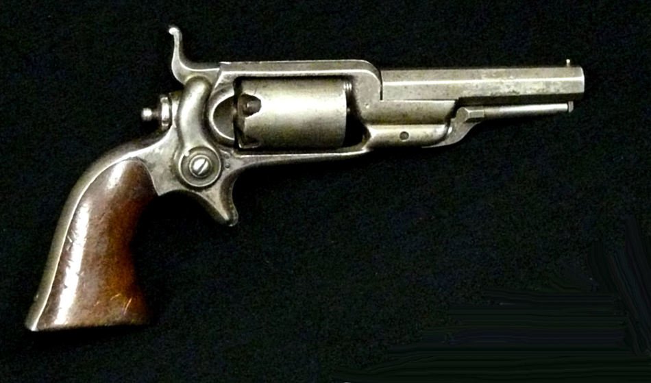 photo of a revolver on a black background