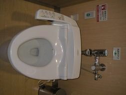 white toilet with bidet