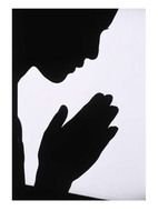 black silhouette of a praying man